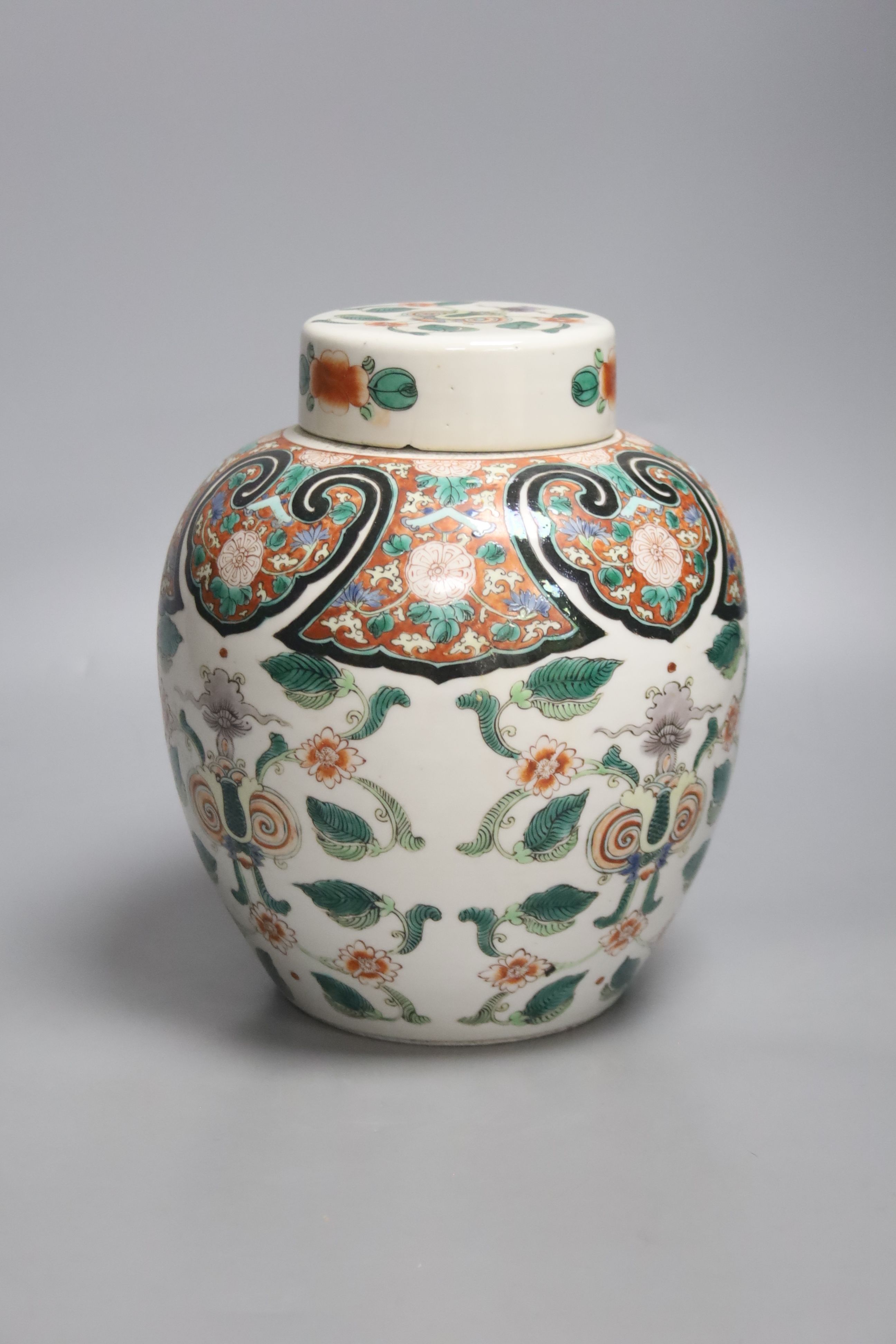 A 19th century Chinese famille verte jar and cover, 22cm high including cover